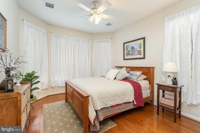 bedroom featuring ceiling fan and hardwood / wood-style flooring