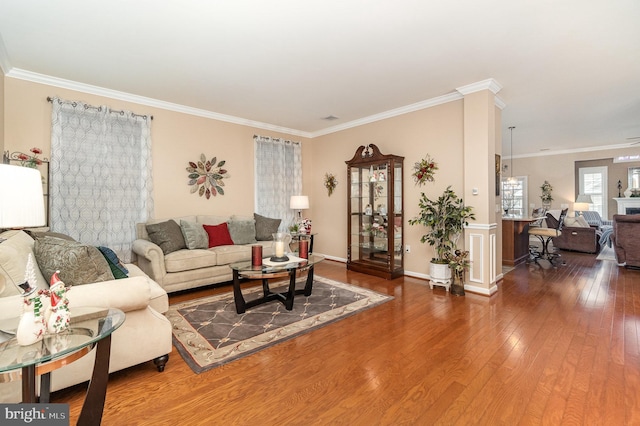 living room featuring hardwood / wood-style floors and ornamental molding