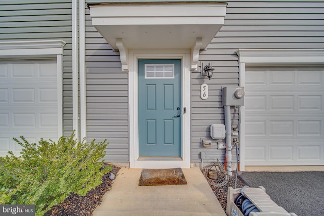 doorway to property featuring a garage