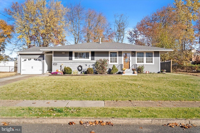 single story home featuring a garage and a front lawn