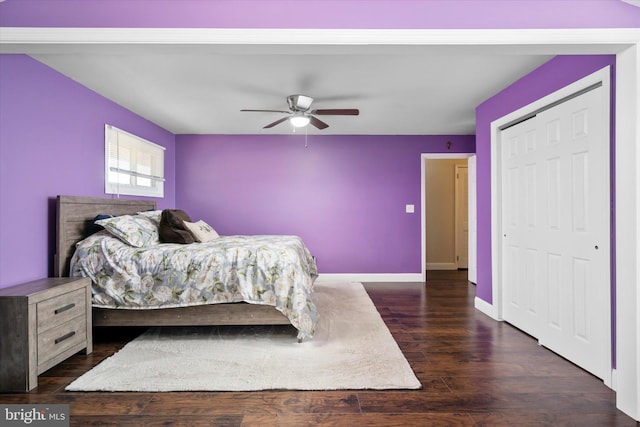 bedroom featuring dark hardwood / wood-style flooring, a closet, and ceiling fan