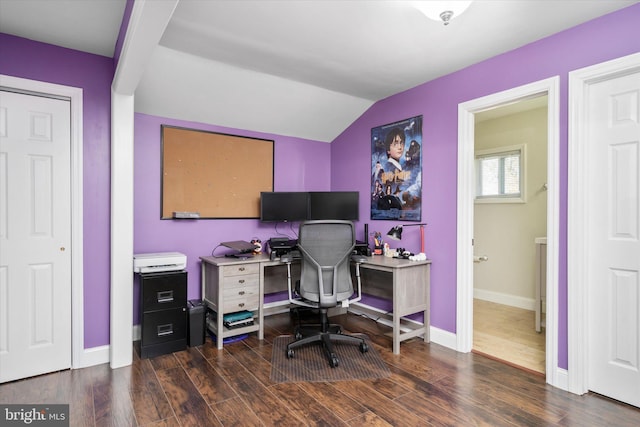 home office with dark wood-type flooring and vaulted ceiling