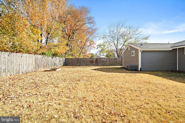 view of yard with central air condition unit