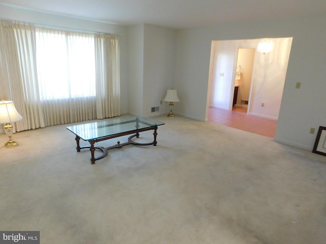 sitting room with light colored carpet