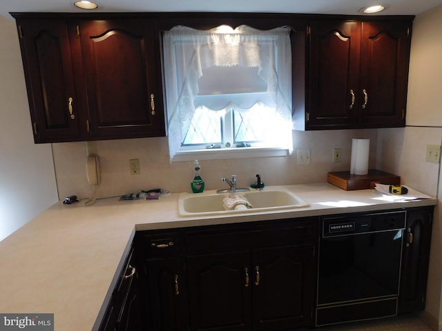 kitchen with black dishwasher and sink