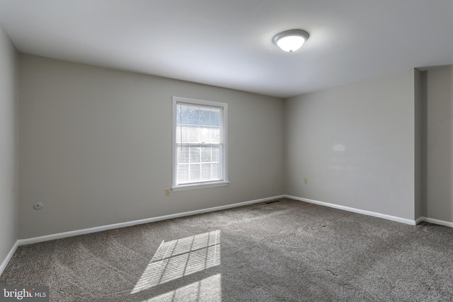 spare room featuring carpet flooring