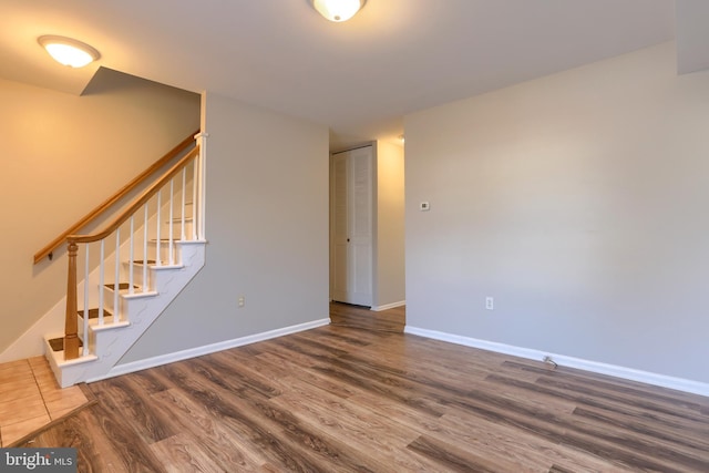 spare room featuring dark hardwood / wood-style floors