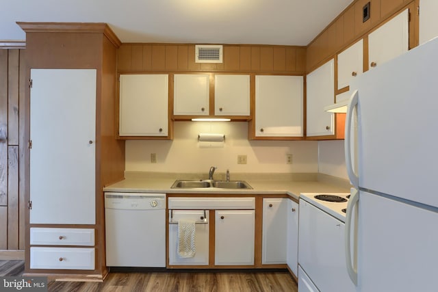 kitchen featuring white cabinets, white appliances, and sink