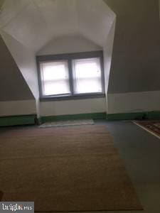 bonus room with a wealth of natural light and vaulted ceiling