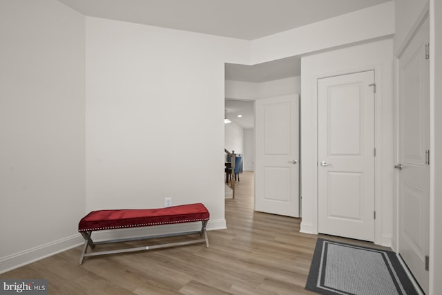 hallway with light wood-type flooring