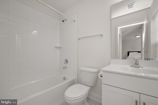 full bathroom featuring vanity, toilet, and tiled shower / bath combo