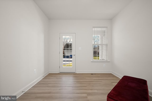 spare room with light wood-type flooring