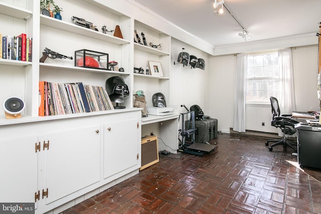 office area featuring brick floor, ornamental molding, and rail lighting