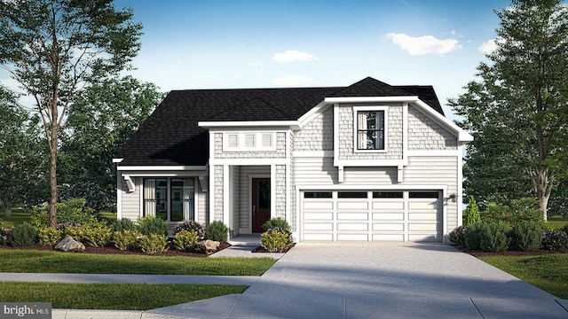 view of front of home featuring a front yard and a garage