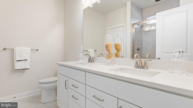 bathroom with walk in shower, tile patterned flooring, vanity, and toilet