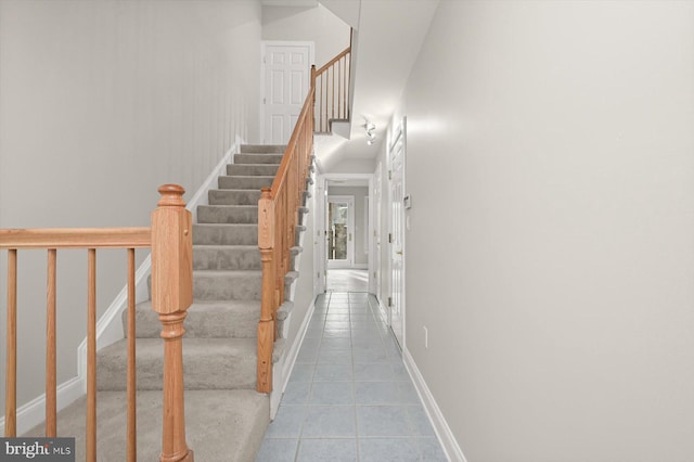 stairs with tile patterned floors