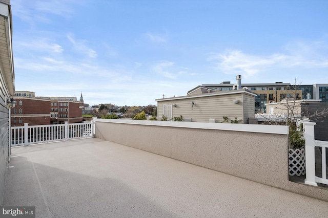 view of patio featuring a balcony