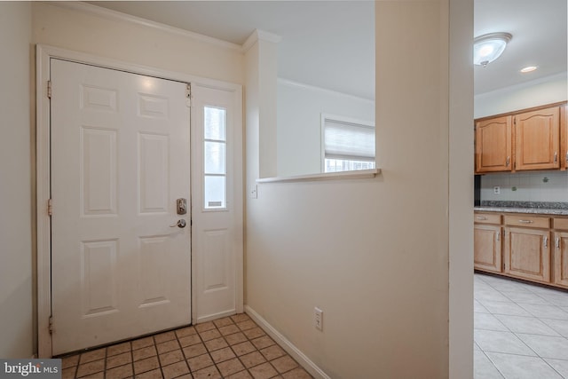 tiled entrance foyer with crown molding