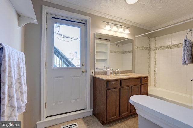 bathroom featuring plenty of natural light, crown molding, and a textured ceiling