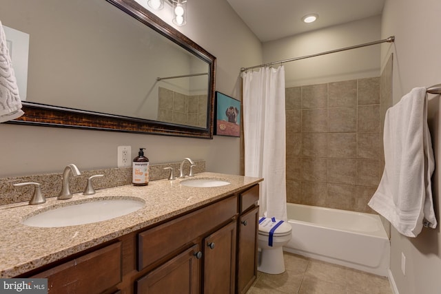 bathroom featuring tile patterned floors, vanity, and shower / bath combo with shower curtain