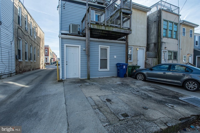 exterior space featuring cooling unit and a balcony