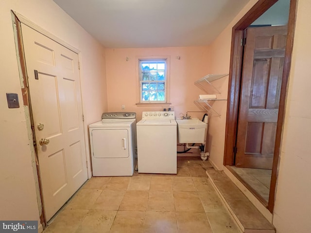 laundry room featuring sink and washer and dryer