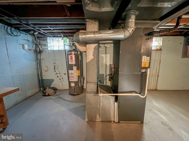 utility room featuring gas water heater