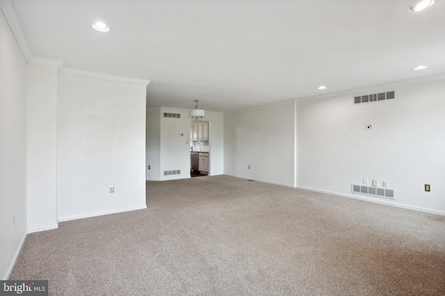 unfurnished living room featuring carpet floors and crown molding