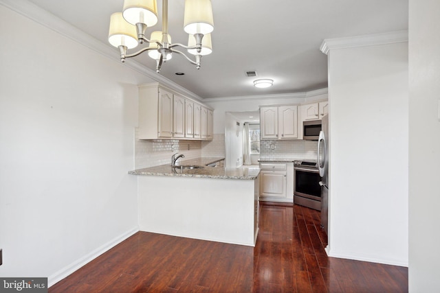 kitchen with dark wood-type flooring, tasteful backsplash, light stone counters, kitchen peninsula, and stainless steel appliances