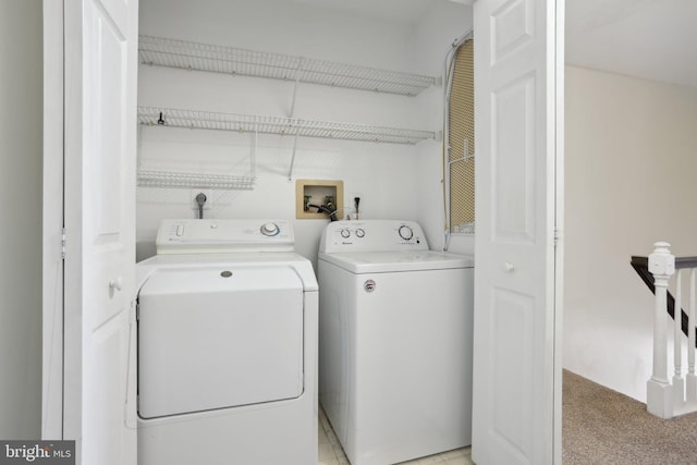 laundry area with light colored carpet and independent washer and dryer