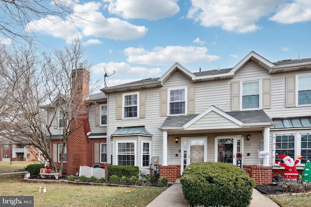 view of property featuring a front yard