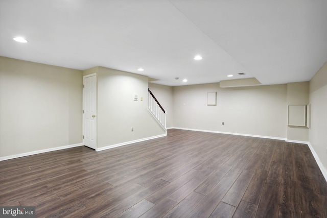 basement featuring dark hardwood / wood-style flooring