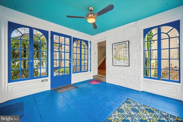 entryway with tile patterned floors and ceiling fan