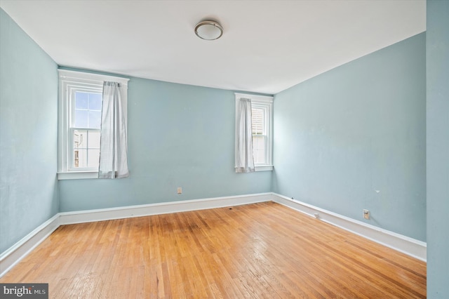 spare room featuring light hardwood / wood-style floors