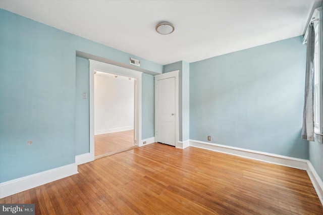 unfurnished bedroom with light wood-type flooring