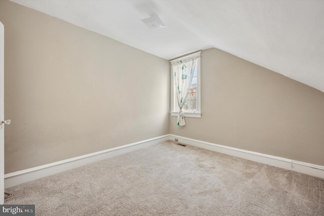 bonus room featuring carpet flooring and lofted ceiling