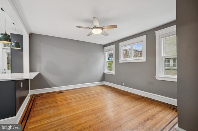 spare room with ceiling fan and light hardwood / wood-style flooring