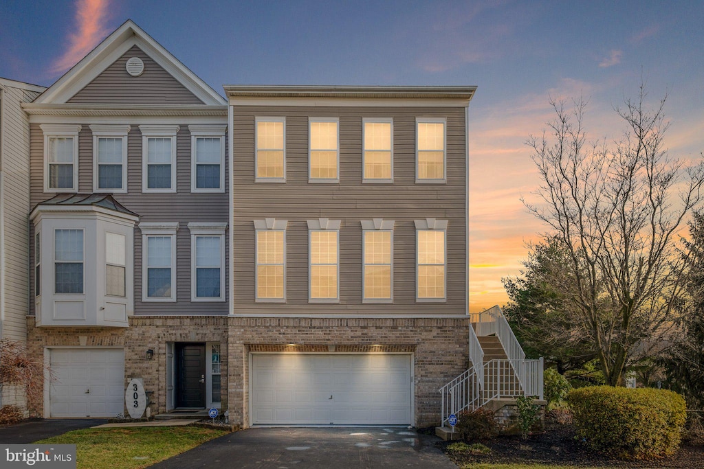 townhome / multi-family property featuring a garage