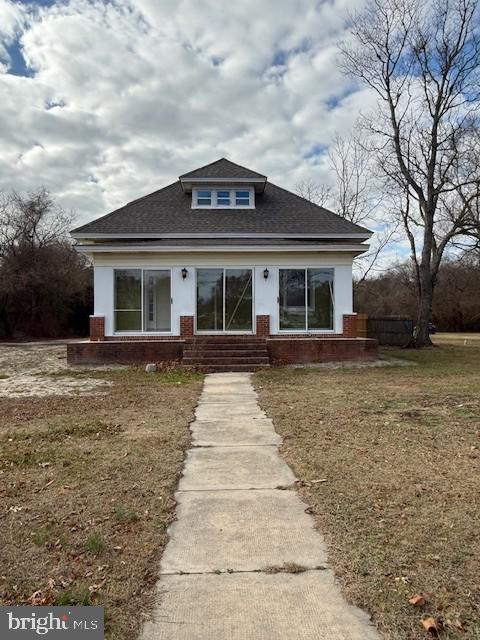 bungalow with a front yard