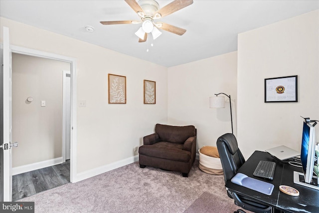 home office with light hardwood / wood-style flooring and ceiling fan