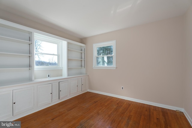 unfurnished room featuring hardwood / wood-style floors