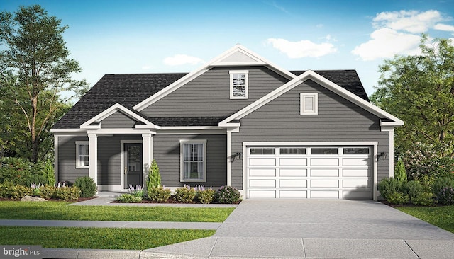 view of front of home with a garage and a front yard