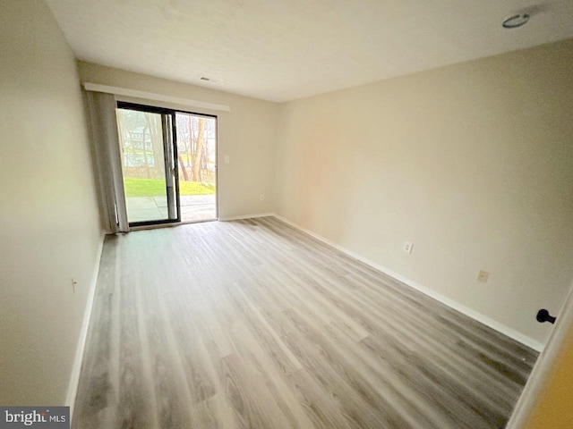 spare room featuring hardwood / wood-style flooring