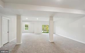 empty room featuring light colored carpet