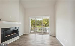 unfurnished living room with wood-type flooring