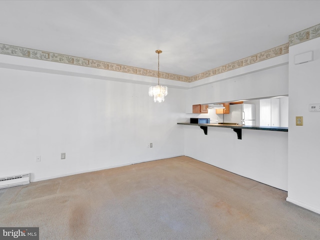 unfurnished dining area with carpet and an inviting chandelier