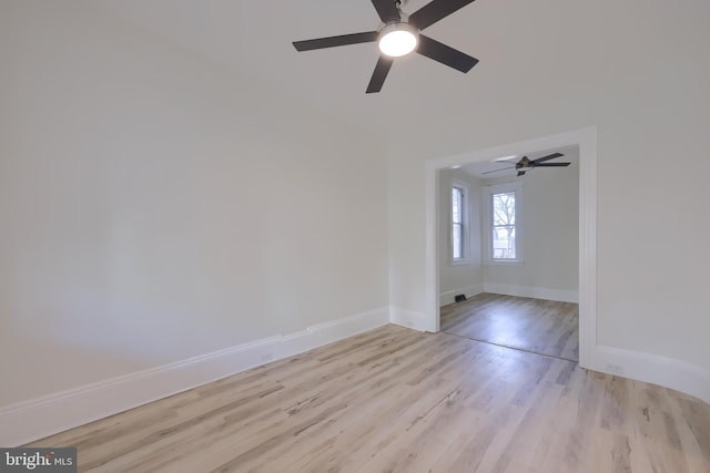 empty room with light hardwood / wood-style floors and ceiling fan