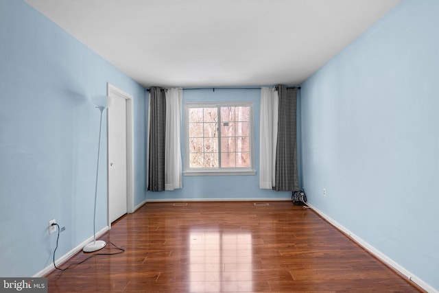 empty room featuring wood-type flooring