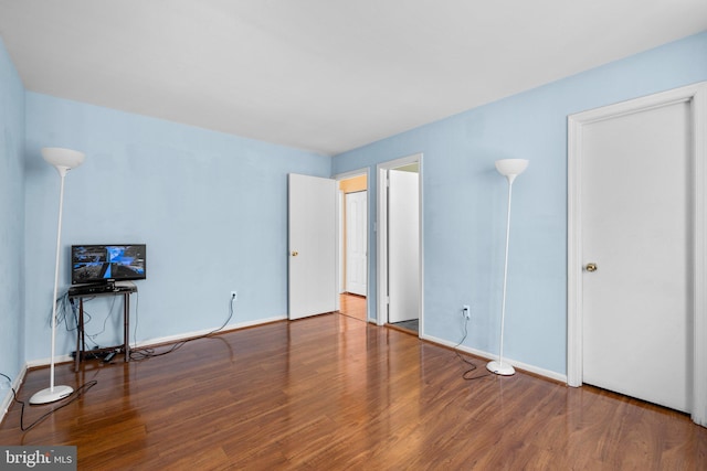 unfurnished bedroom with wood-type flooring