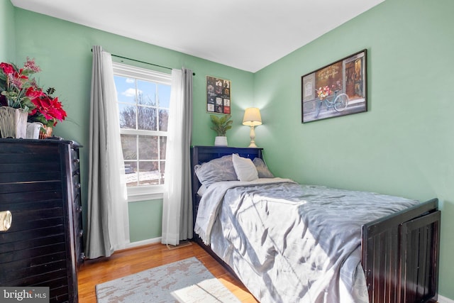 bedroom with wood-type flooring